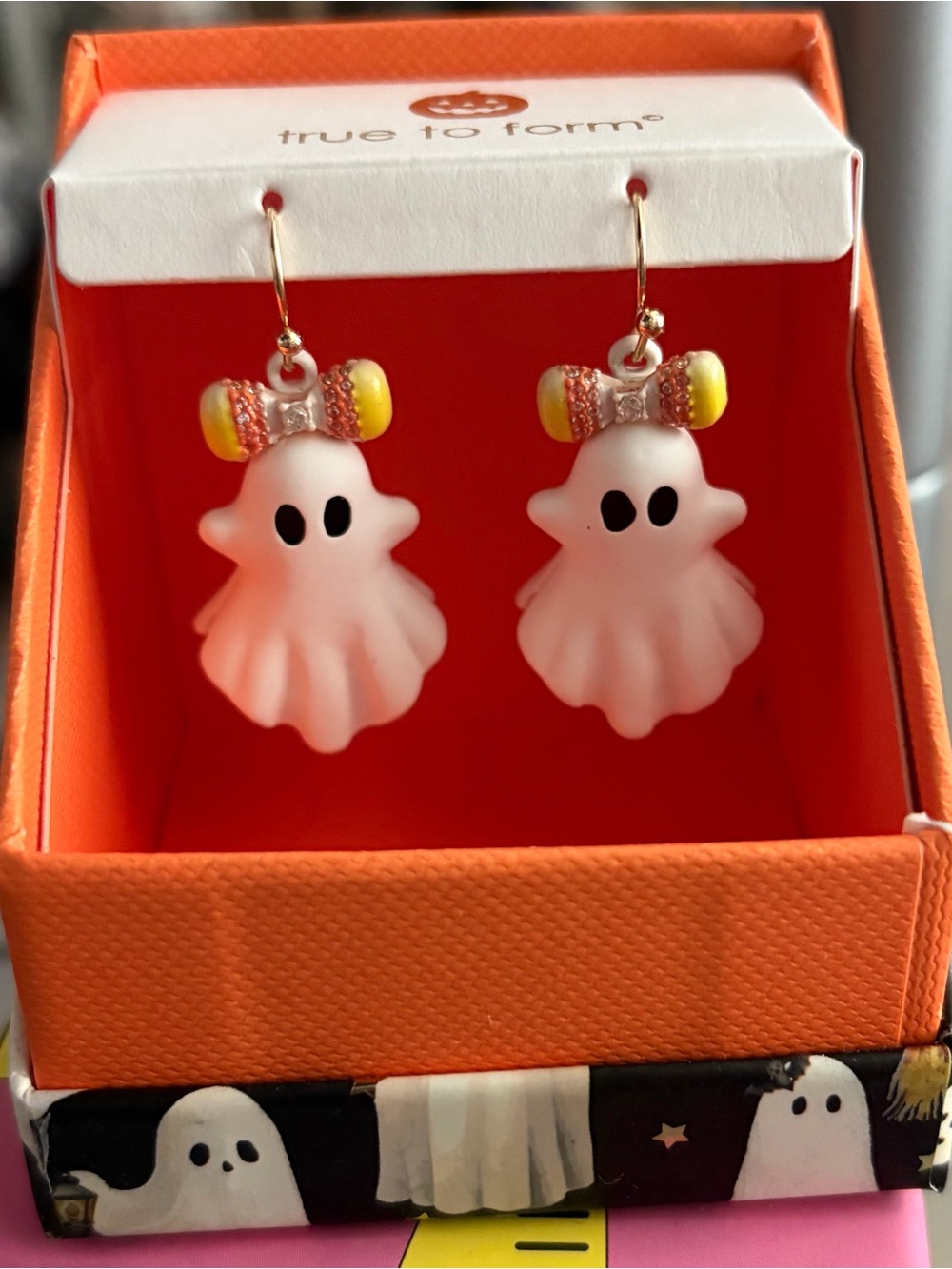 True to Form White Ghost Drop Earrings with Yellow Bow Accents